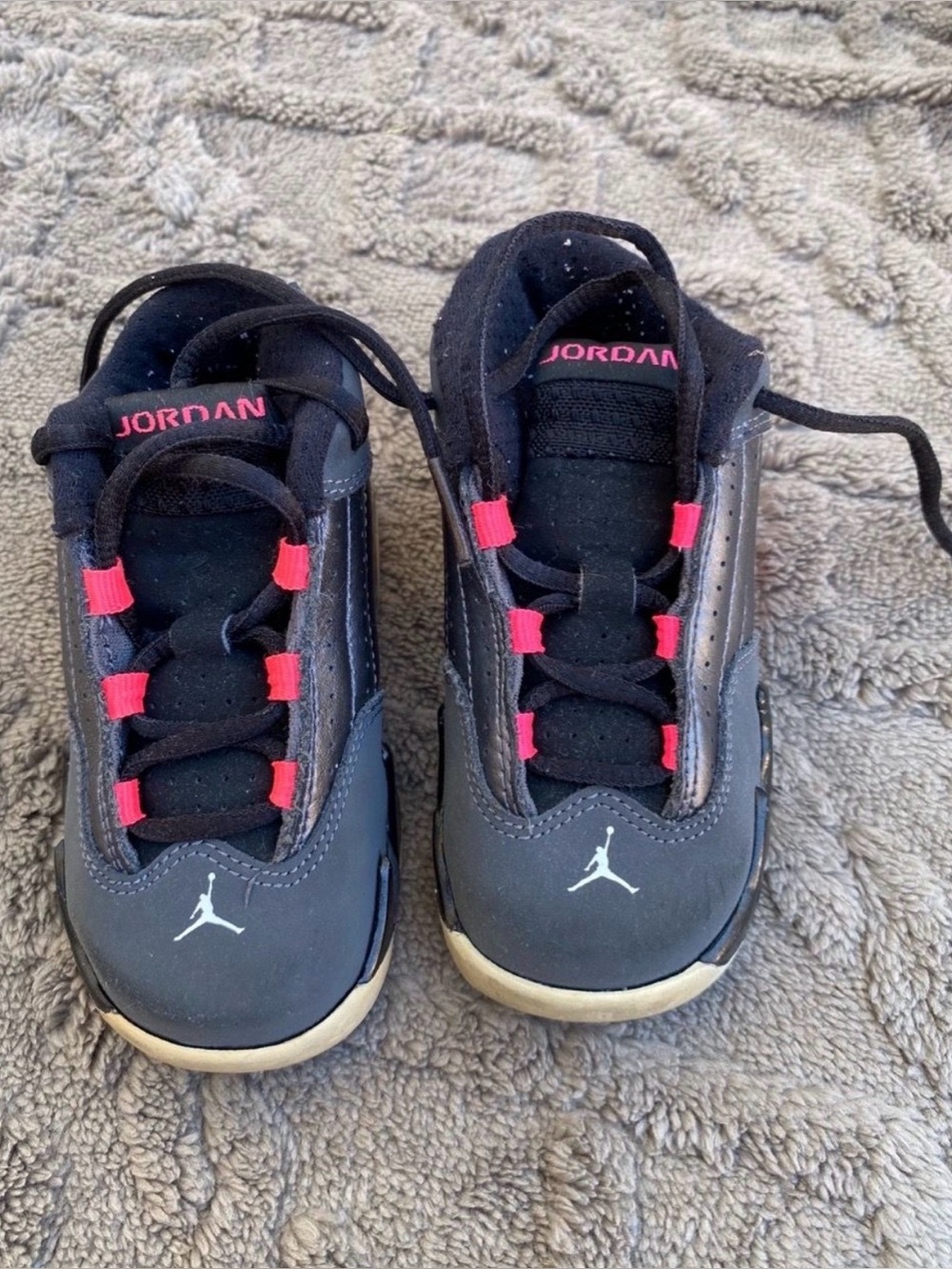 Jordan kids sneakers in US size 7C featuring a black and dark gray colorway